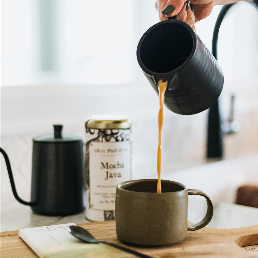 Coffee being poured into the 8oz green handmade coffee mug.